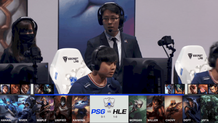 A screenshot from the 2021 World Championship Main Event Group Stage broadcast, showing the champion drafts between PSG.Talon and Hanwha Life Esports with a shot of PSG players and coaches above.