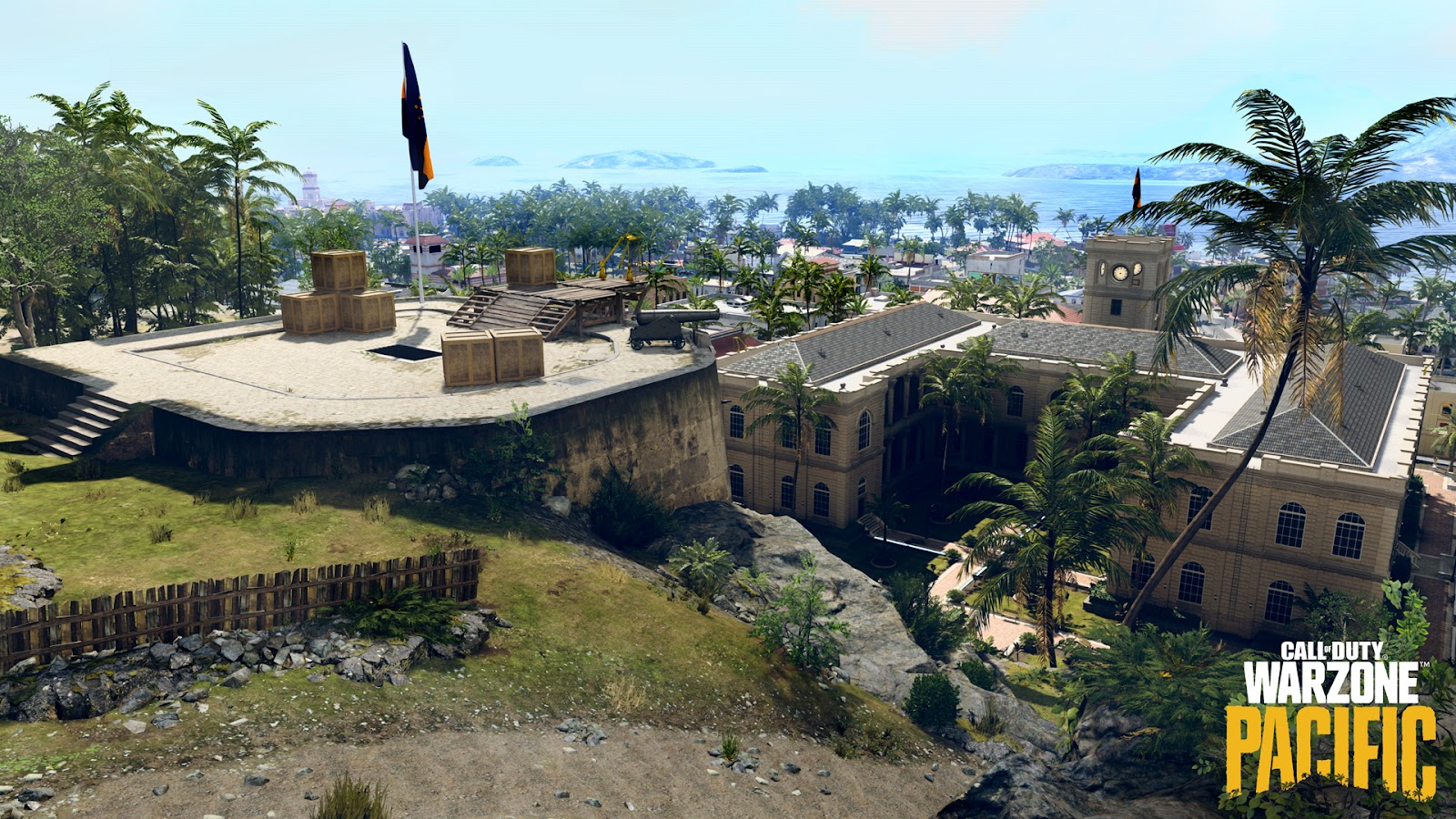 A new promotional image for the location of Caldera in the new Warzone Pacific update showing a military base on a hilltop overlooking an idyllic coastal city with palm trees and sandstone buildings