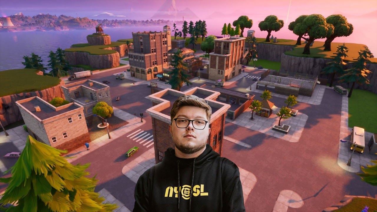 Aydan "Aydan" Conrad appears in his New York Subliners hoodie against the backdrop of Tilted Towers from Fortnite's first map