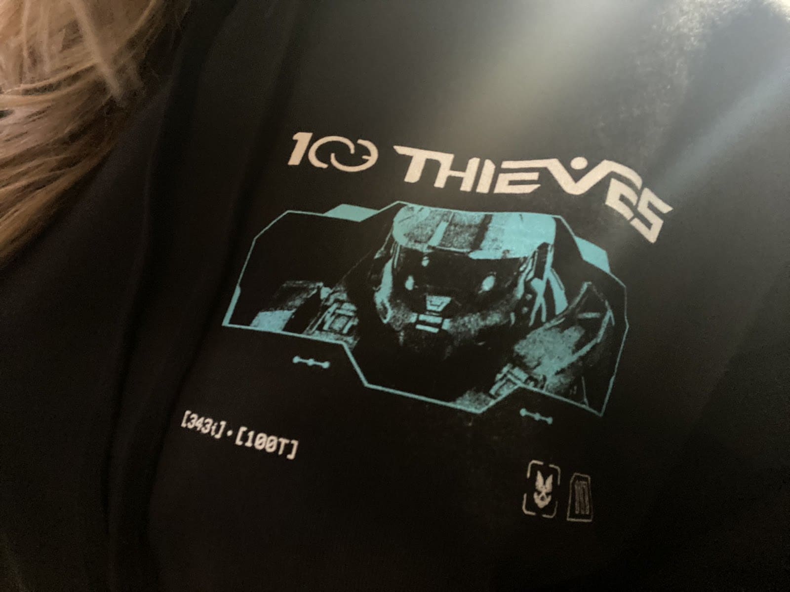A sneak peak at the design of the new Halo x 100T apparell range, featuring the iconic Halo Master Chief helmet design and the 100 Thieves logo