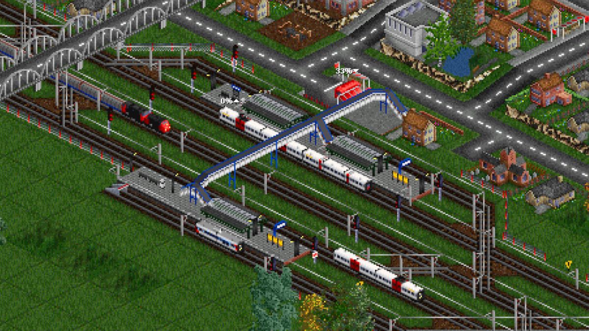 An image from transport game OpenTTD of trains and a village