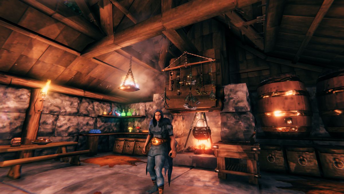 A character stands in front of a Valheim spice rack, which is hanging from a beam above a cauldron