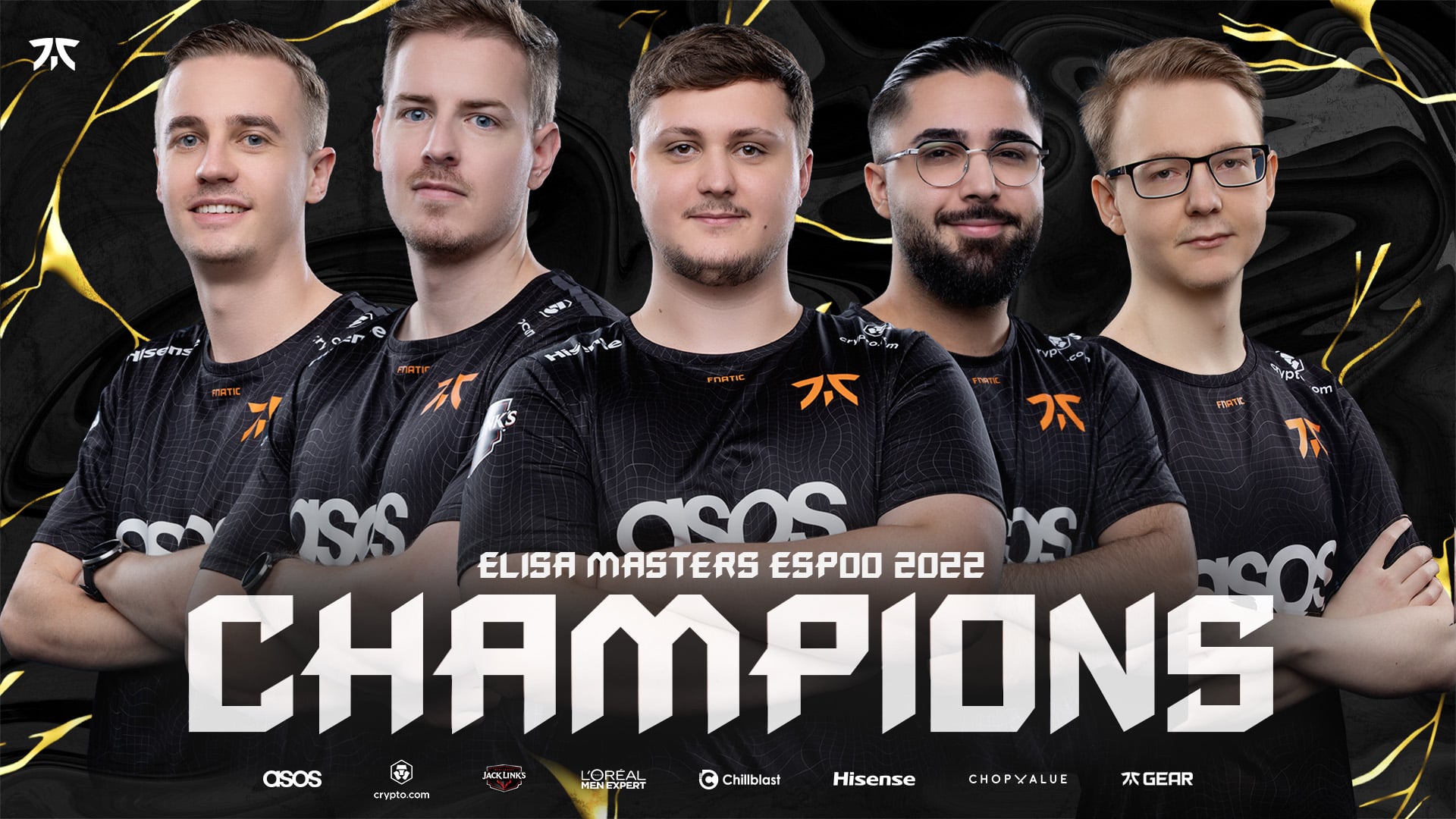 The CSGO roster for Fnatic stand, arms folded, in their team jerseys, underneath the words "Elisa Masters Espoo Champions" appears in bold white letters