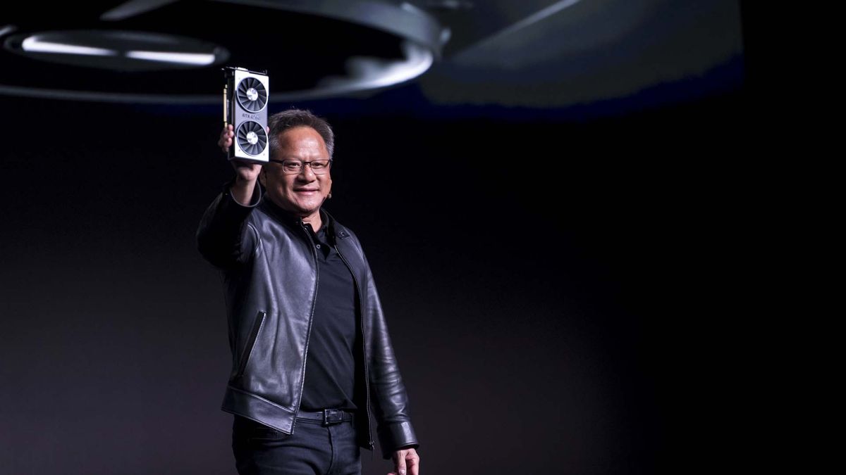 Jen-Hsun Huang, president and chief executive officer of Nvidia Corp., holds up the new Nvidia GeForce RTX 2060 graphics processor during the company