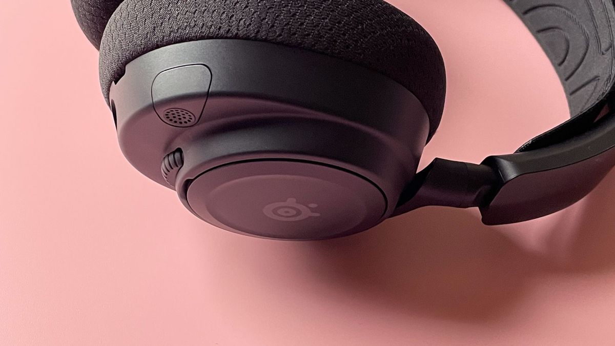 The SteelSeries Arctis Nova 7 Wireless on a pink background.