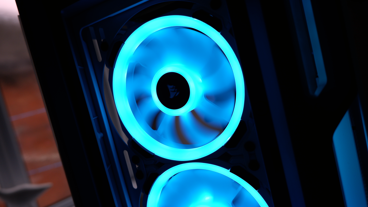 Corsair iCUE 5000T RGB mid-tower PC case with RGB lighting enabled in blue and pink