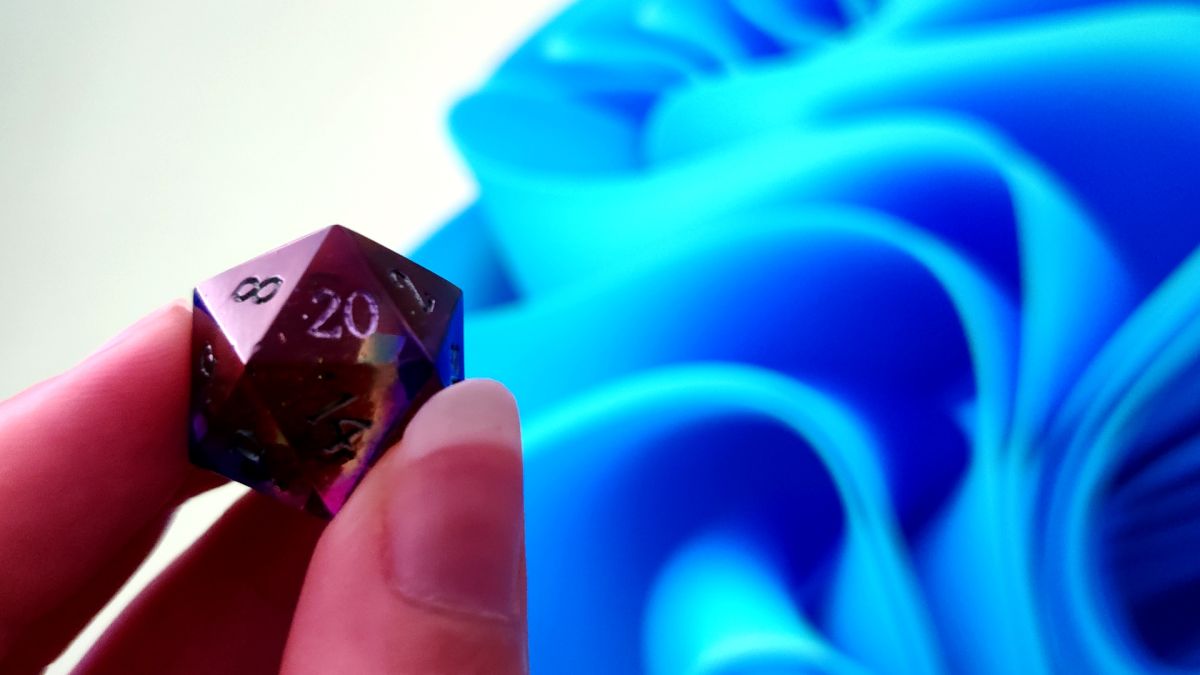 Windows 11 default background with a D20 in the foreground, showing a natural 20..