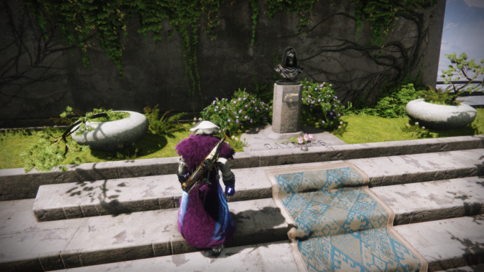 A Guardian stands at the memorial to Cayde-6.