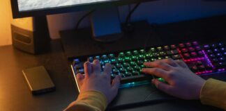 Hands on a multi colored gaming keyboard
