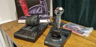 The Hori HOTAS Flightstick and throttle control, displayed in front of the box on a desk