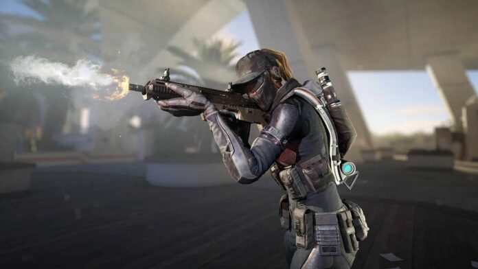 XDefiant promo image - woman in a commando-style outfit firing a rifle