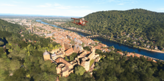 A Pitts Special flies over a German town.