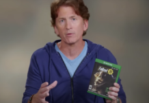 Todd Howard, director and executive producer at Bethesda, holds a copy of Fallout: 76.