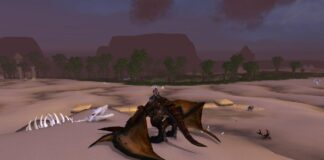 WoW Cataclysm map - a player is sat on a dragon mount in a desert in Uldum