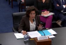 US Commerce Secretary Gina Raimondo speaking at a hearing in the US house